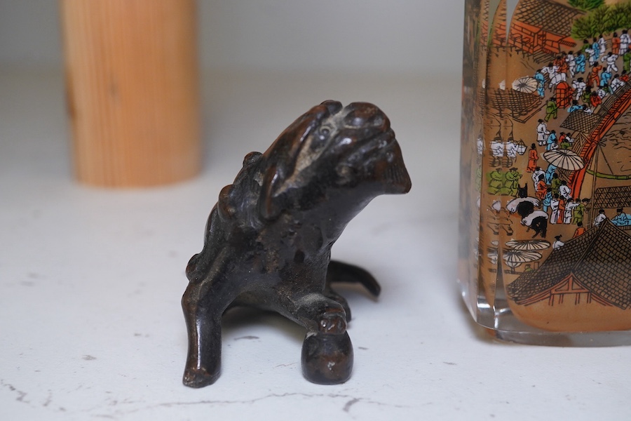 A Japanese bronze koro and cover, 23.5cm high, together with a inside painted glass snuff bottle, 8.5cm high. Condition - fair, dog detached from cover of koro, etc.